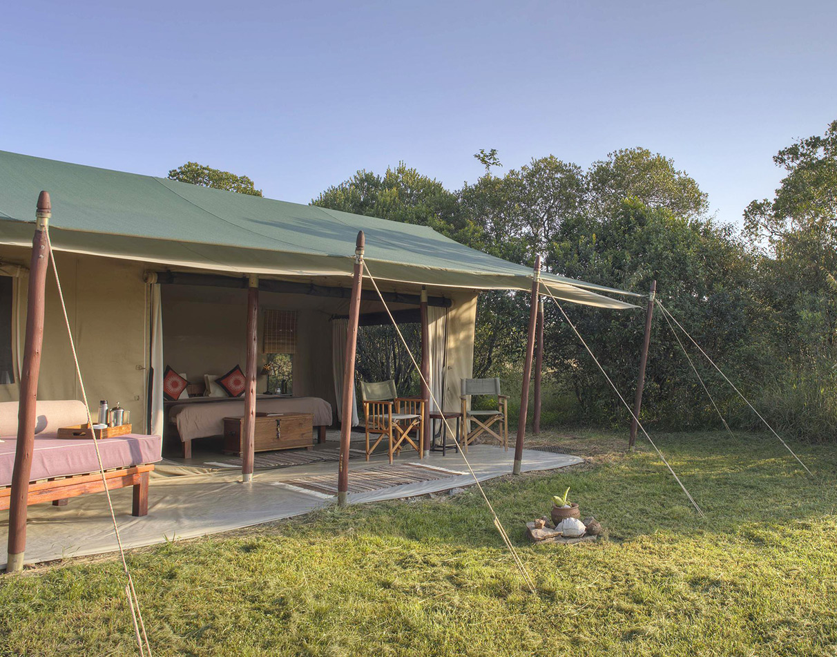 A guest tent at Asilia Encounter Mara Camp and its surroundings