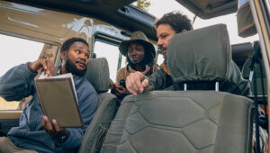 Safari guide explains Kenya culture and languages to his guests.