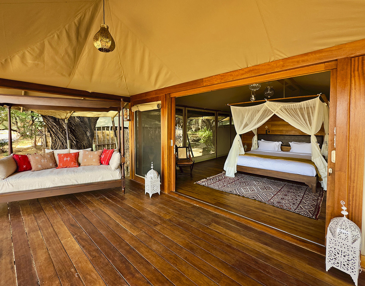 Interior of a luxury guest tent with veranda at Soroi Larsens Camp