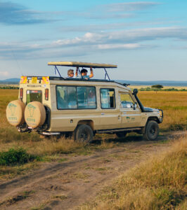 A photo safari vehicle on game drive with guests.