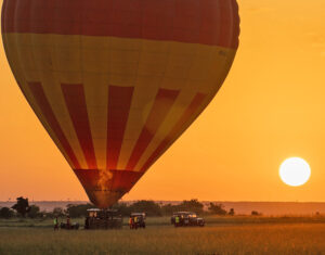 The launch site of a hot air balloon safari in Kenya at sunrise.