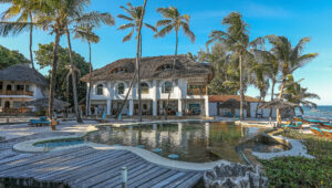 The main building and pool deck at Water Lovers Beach resort.