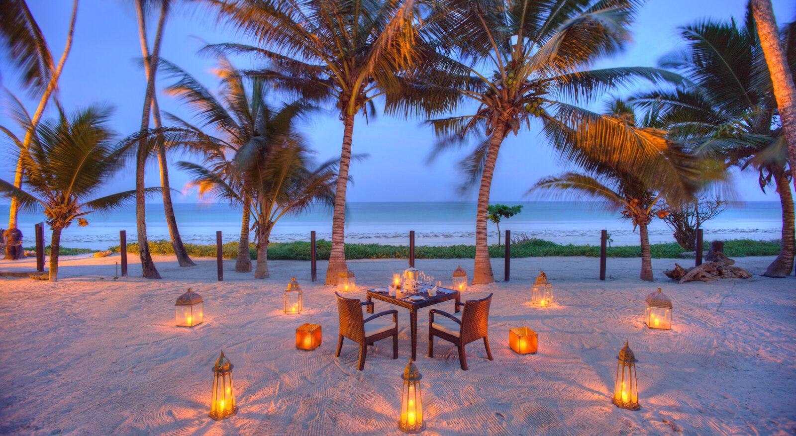 A private dinner table set at Almanara Resort on the Kenyan coast