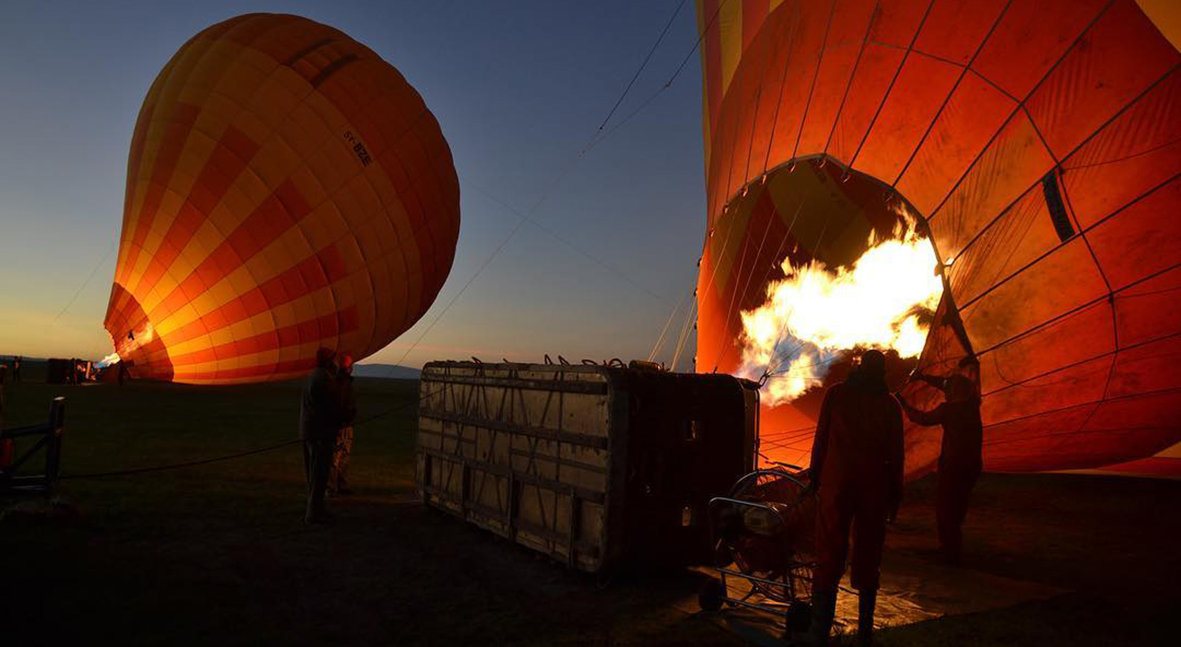 Balloons being infated for a hot air balloon ride over the Masai Mara Reserve. Balloons being infated for a hot air balloon ride over the Masai Mara Reserve.