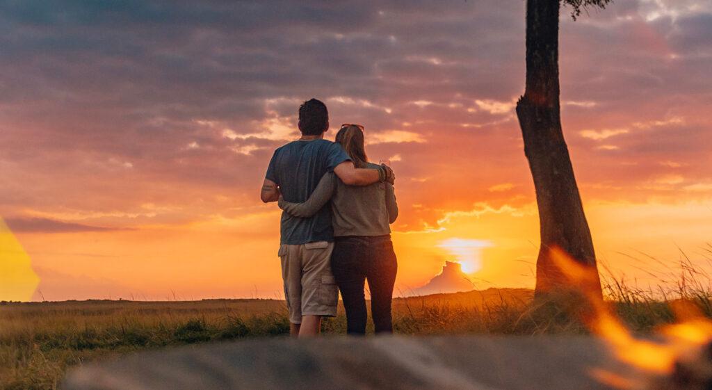 A couple at sunset in the Masai Mara.